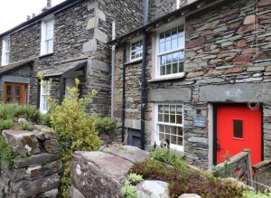 Exterior of Little Robin stone holiday cottage in Ambleside, a traditional Lake District stay for the Beatrix Potter 160th anniversary.